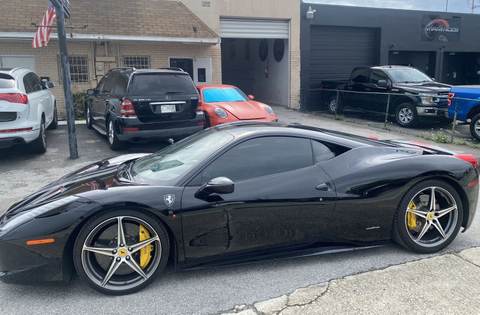Black Ferrari 458 Italia outside 302 S Dixie Hwy, Gold Coast Collision Center, Pompano Beach