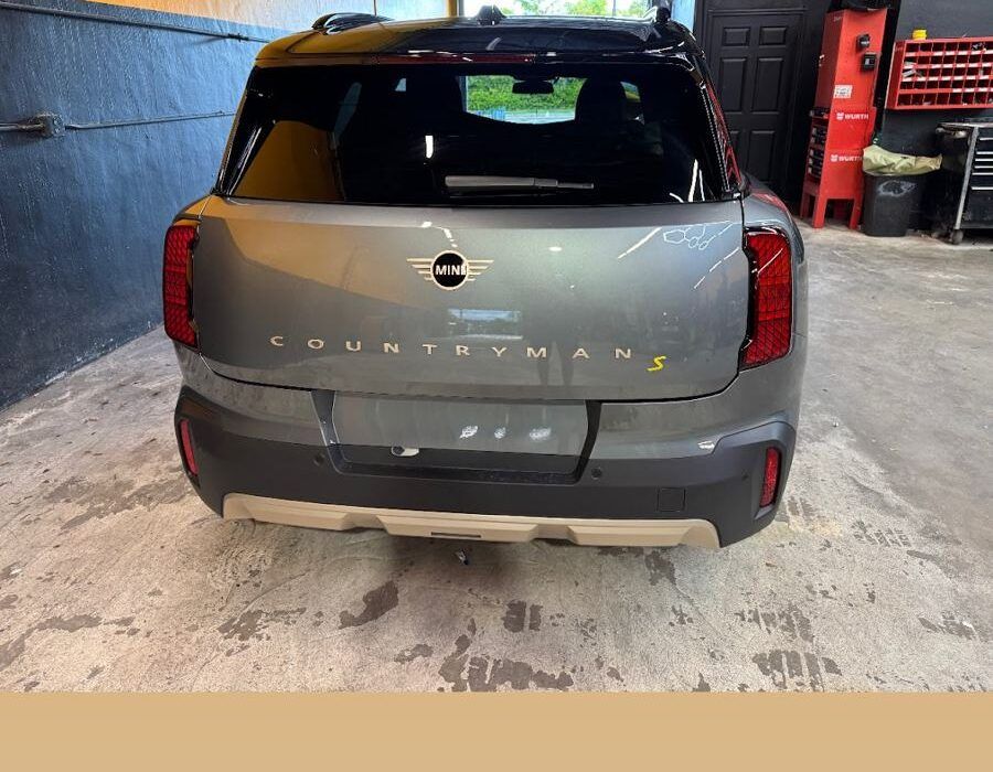 Gray Mini Countryman S after rear collision repair inside Gold Coast Collision Center
