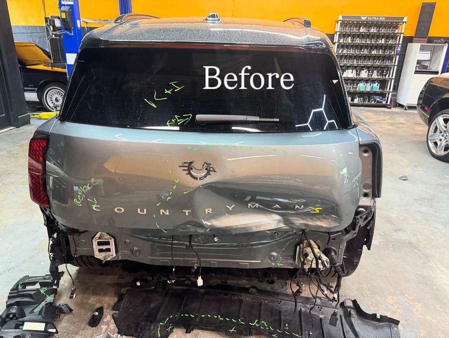 Mini Countryman S with rear collision damage and the bumper removed before repair at Gold Coast Collision Center